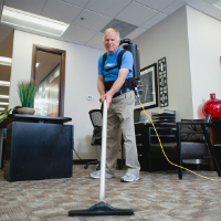 Office cleaning services - cacuuming carpet